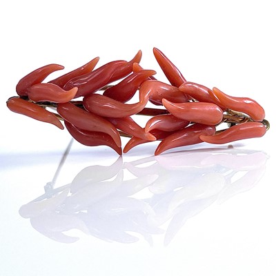 Lot 33 - A 19th century coral mounted gilt metal brooch,...