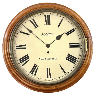 Lot 72 - A circular oak railway wall clock, late 19th century.