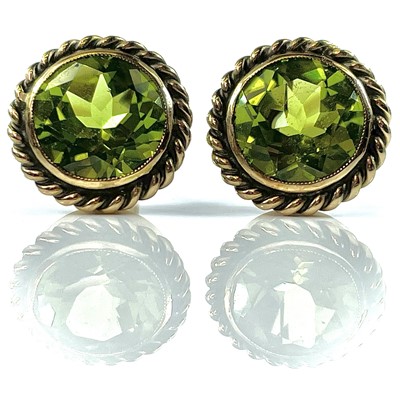 Lot 216 - A pair of 14ct gold peridot set stud earrings,...