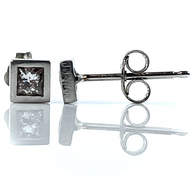 Lot 144 - A pair of platinum diamond stud earrings, each...