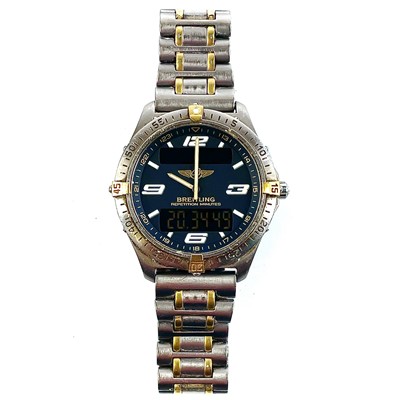 Lot 298 - A Breitling Aerospace titanium and gold plated gentleman's bracelet wristwatch.