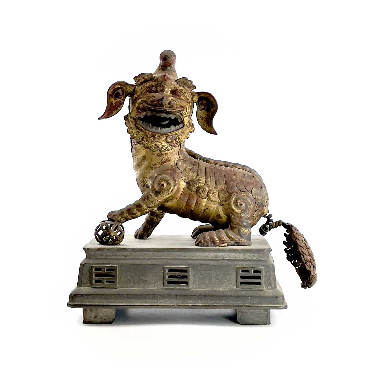 Lot 52 - A Chinese gilt metal model of a dog of fo,...