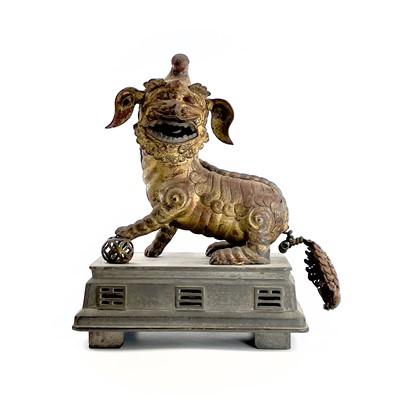 Lot 52 - A Chinese gilt metal model of a dog of fo,...
