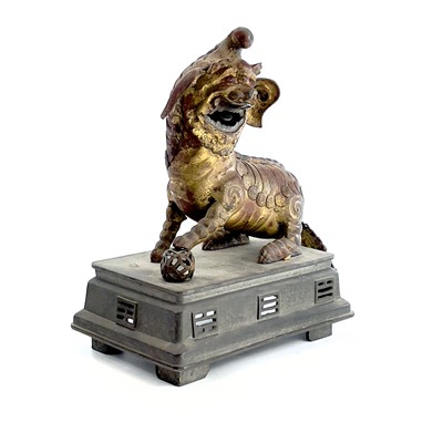 Lot 52 - A Chinese gilt metal model of a dog of fo,...