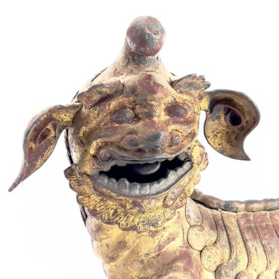 Lot 52 - A Chinese gilt metal model of a dog of fo,...