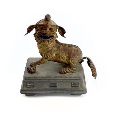 Lot 52 - A Chinese gilt metal model of a dog of fo,...
