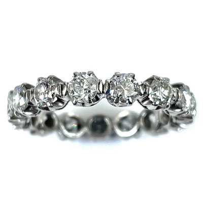 Lot 64 - An 18ct white gold diamond full eternity 15...