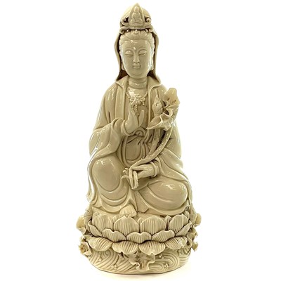 Lot 197 - A Chinese blanc de chine figure of Guanyin,...
