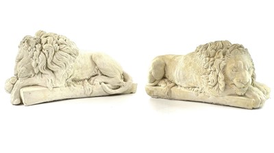 Lot 140 - A pair of plaster Chatsworth sleeping lions...