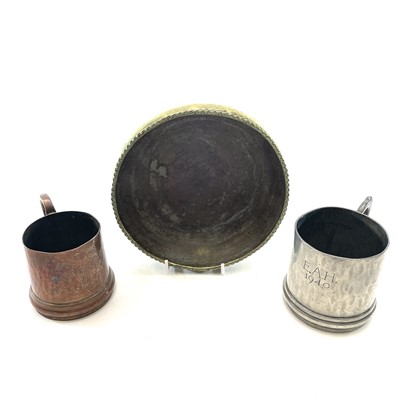 Lot 97 - An Arts and Crafts hammered brass bowl by Hugh...