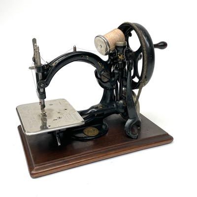 Lot 7 - A Willcox and Gibbs 'Silent' sewing machine,...