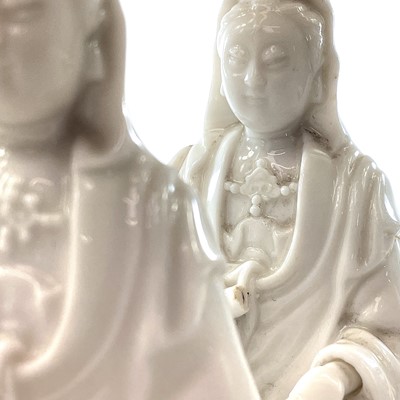 Lot 39 - Two Chinese blanc de chine figures of Guanyin,...