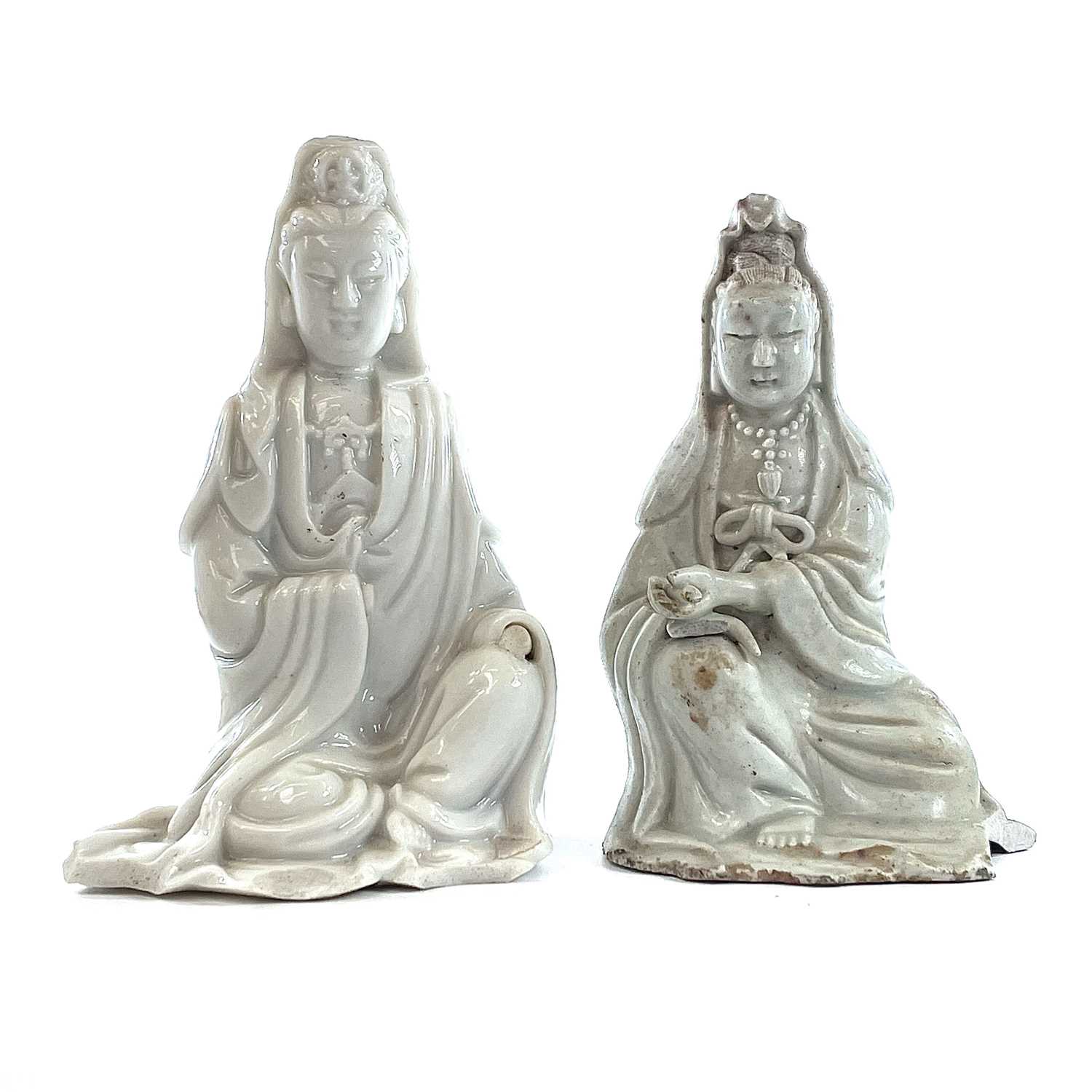 Lot 40 - Two Chinese blanc de chine figures of Guanyin,...