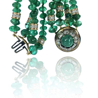 Lot 101 - Tambetti - A gold mounted emerald and diamond...