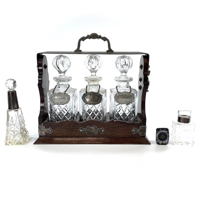 Lot 147 - An Edwardian oak and silver plated three...