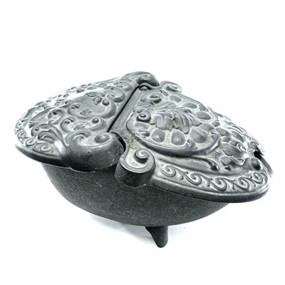 Lot 137 - A Victorian cast iron oval coal box ornately...