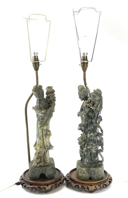 Lot 163 - A pair of Chinese green hardstone figures of...