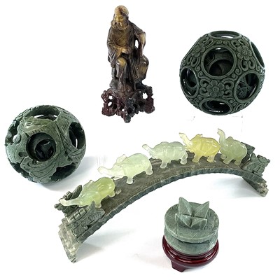 Lot 168 - Two Chinese green hardstone puzzle balls,...