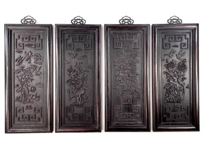 Lot 175 - A set of four Chinese rectangular carved wood...