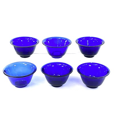 Lot 211 - Six Peking blue glass bowls, largest height...
