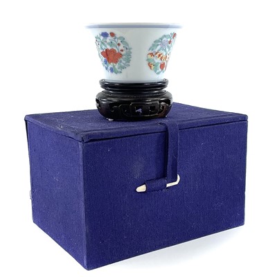 Lot 216 - A Chinese doucai porcelain cup, Qing Dynasty,...