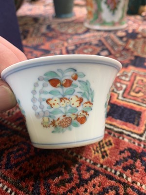 Lot 216 - A Chinese doucai porcelain cup, Qing Dynasty,...