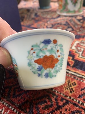 Lot 216 - A Chinese doucai porcelain cup, Qing Dynasty,...