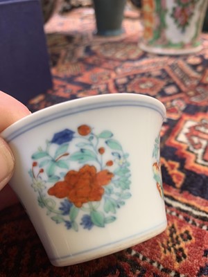 Lot 216 - A Chinese doucai porcelain cup, Qing Dynasty,...