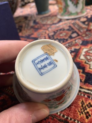 Lot 216 - A Chinese doucai porcelain cup, Qing Dynasty,...