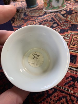 Lot 216 - A Chinese doucai porcelain cup, Qing Dynasty,...
