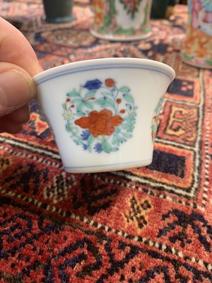 Lot 216 - A Chinese doucai porcelain cup, Qing Dynasty,...