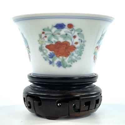 Lot 216 - A Chinese doucai porcelain cup, Qing Dynasty,...