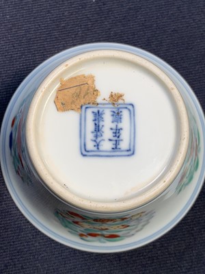 Lot 216 - A Chinese doucai porcelain cup, Qing Dynasty,...