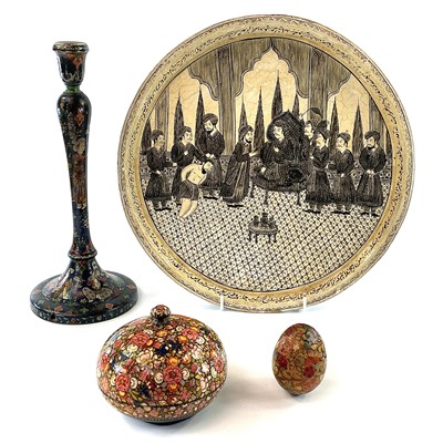 Lot 1011 - A Persian black lacquered candlestick, early...