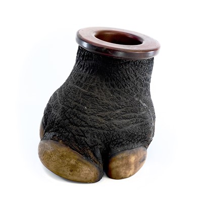 Lot 1012 - A taxidermy rhino foot tobacco jar, 19th...