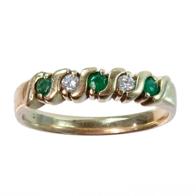 Lot 96 - A modern 9ct hallmarked gold emerald and diamond five stone ring.