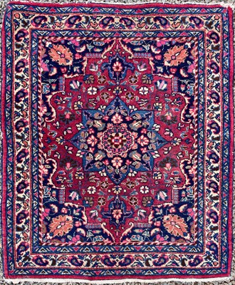 Lot 1228 - A Mashad rug, North East Persia, the madder...