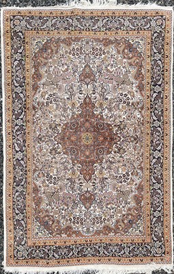 Lot 1229 - A Tabriz rug, North West Persia, the ivory...