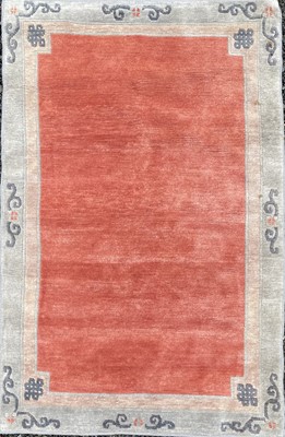 Lot 1245 - A contemporary Tibetan rug, the plain red...