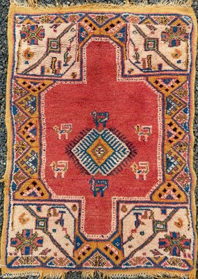 Lot 1248 - A Turkish Ushak rug, the madder field with a...