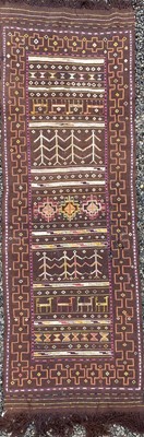 Lot 1252 - A kelim runner, the brown field with animals,...