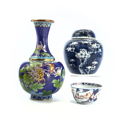 Lot 304 - A Chinese porcelain blue and white prunus...