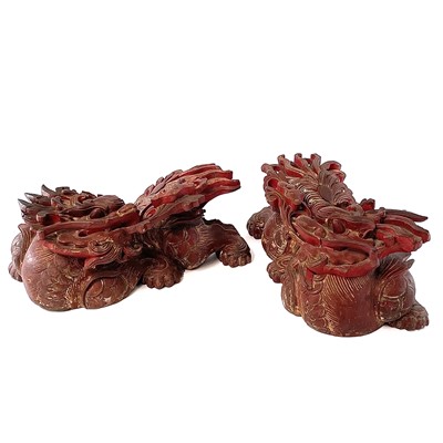 Lot 312 - A pair of Chinese carved wood candle holders...