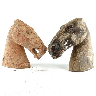 Lot 325 - Two Chinese painted pottery horse heads,...