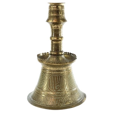 Lot 1037 - An Islamic brass candlestick, 19th century,...