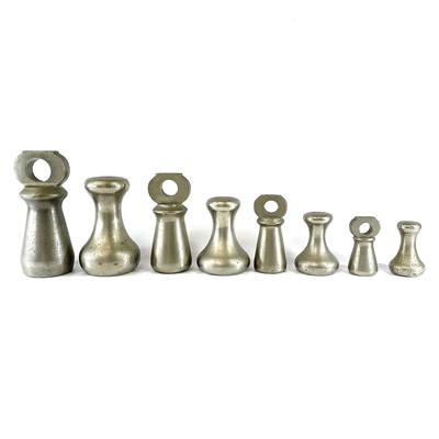 Lot 233 - A set of four nickel bell weights, 7LB - 1LB,...