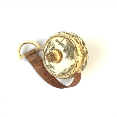 Lot 2687 - A novelty bone tape measure charmingly...