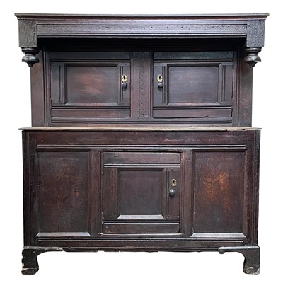Lot 13 - An oak duodarn, late 17th/early18th century.