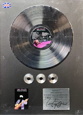 Lot 23 - Gold Disc presented to Mark Knopfler.