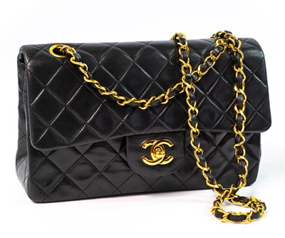 Lot 386 - A Chanel Double Flap handbag in black lambskin with gold tone hardware.